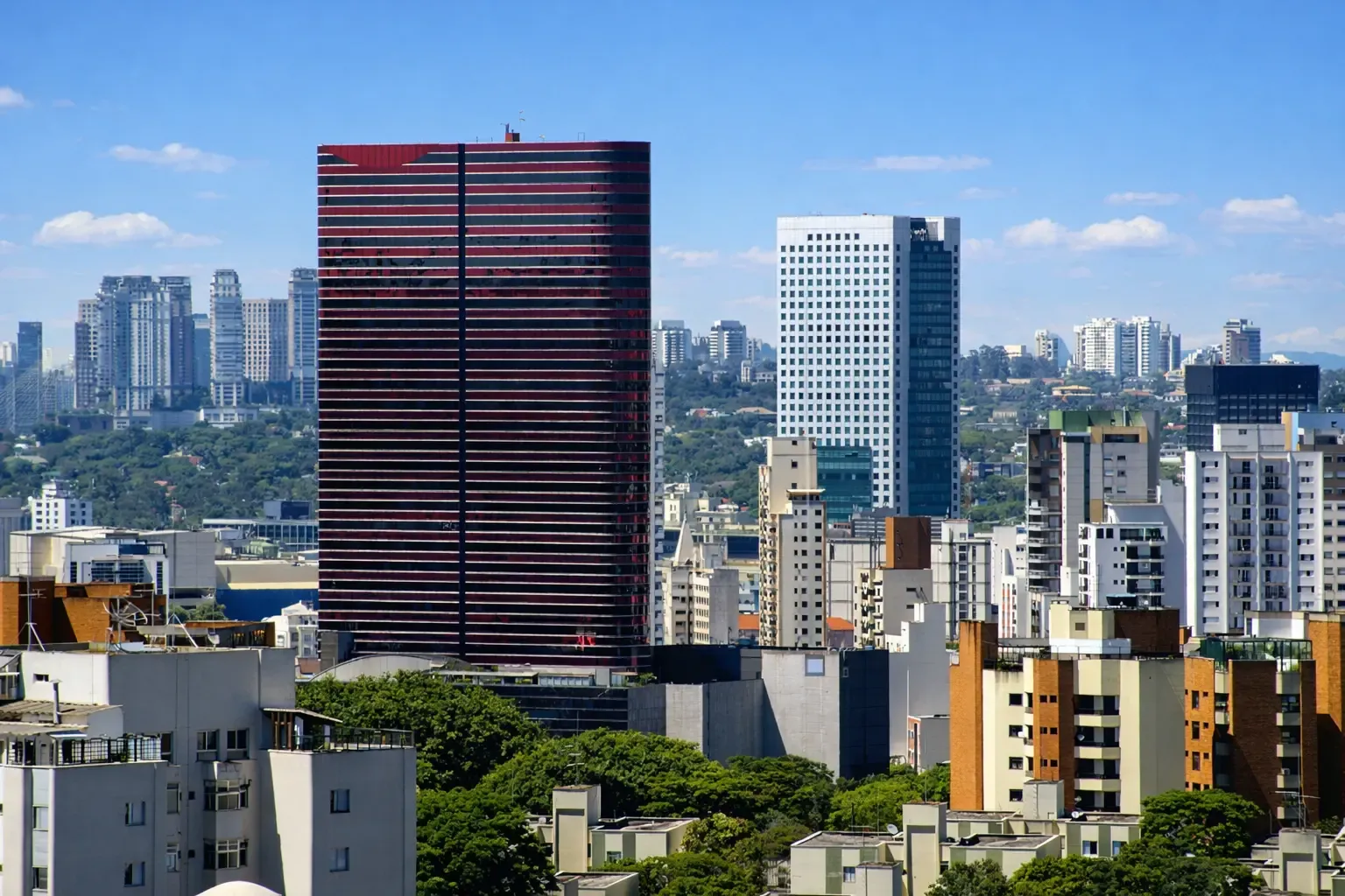 Modern residential towers under a blue sky in Pinheiros