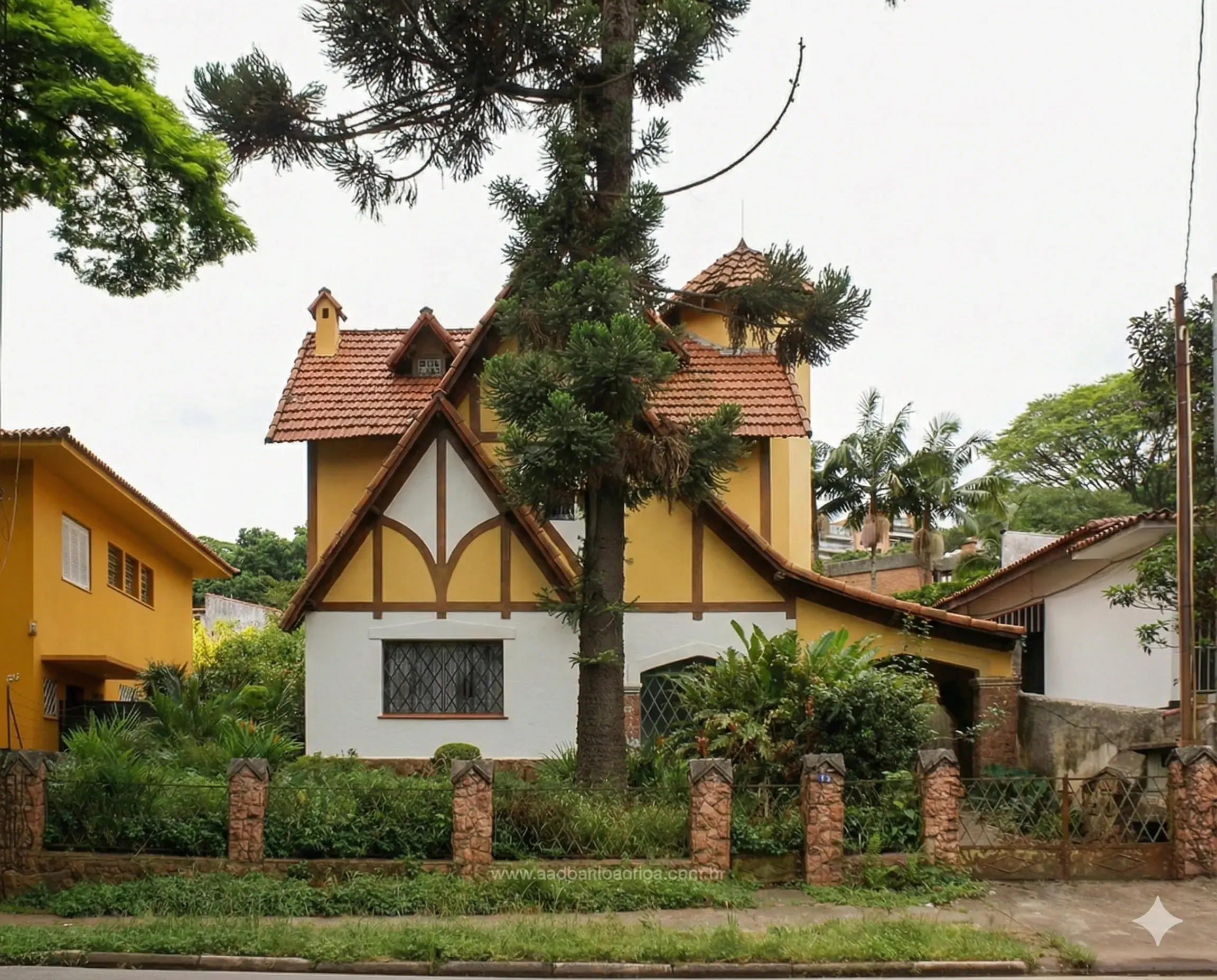Charming yellow house with a steep tiled roof and lush front garden