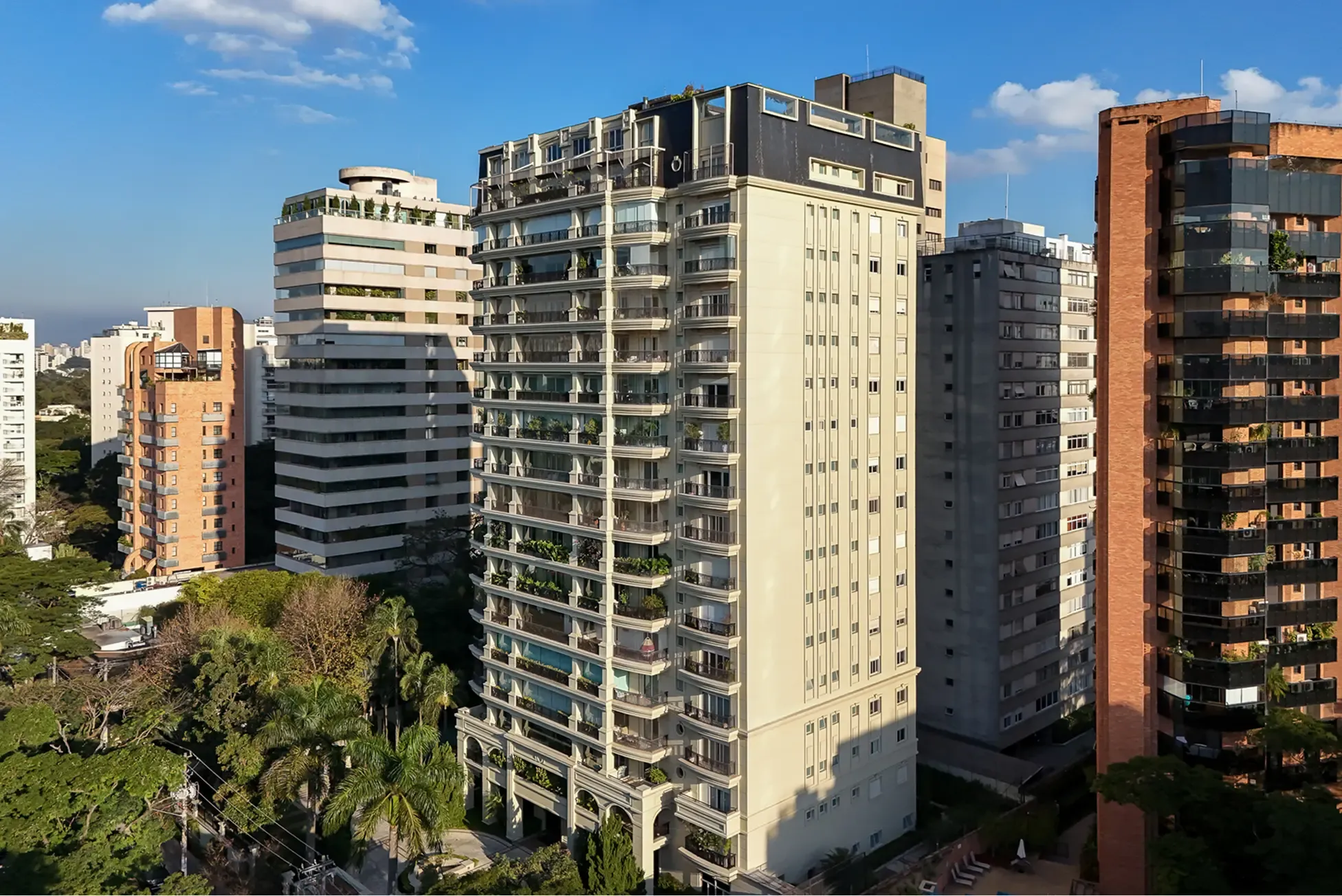 Cluster of modern apartment towers with greenery below