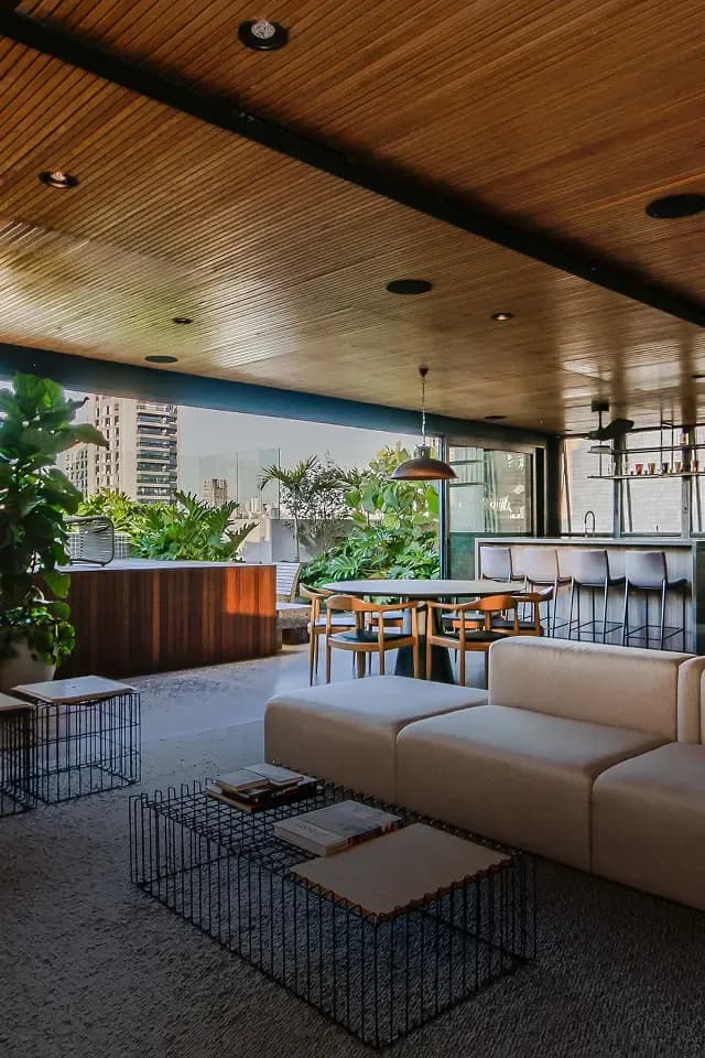 Covered outdoor living area with wood ceiling